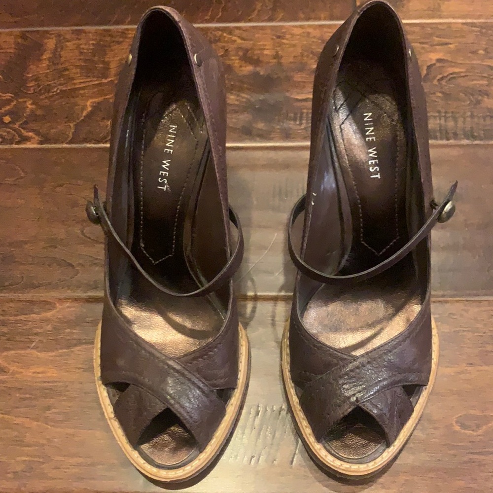 Nine West wedge with grommet detail around heal. Open toe and strap